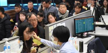 Alarma tras confirmar China que virus se contagia entre humanos