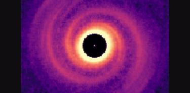 Imagen de un planeta gigante impulsando brazos espirales en un disco protoplanetario a partir de simulaciones teóricas.